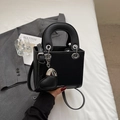 Black lychee leather crossbody handbag with silver hardware and heart charm - Black