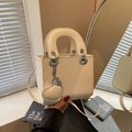 Chic beige lychee grain crossbody handbag with heart charm and top handles - Off-white