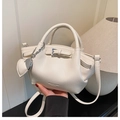 Chic cream pleated bucket bag in lychee textured faux leather with heart pendant - White