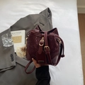 Fashionable wine red bucket bag with snake skin pattern and cute faux fur pom pom charm - Wine Red With Pendant