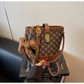 Detail of contrast bucket bag with geometric pattern, gold clasp and charm pendant - Coffee (With Pendant)