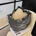 Dark grey pleated crescent hobo bag with glossy finish and cloud-style shoulder strap - Gray