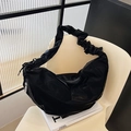 Fashionable black pleated shoulder bag with a crescent shape and glossy finish - Black