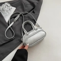 Minimalist silver pebble grain boston bag with dual top handles and crossbody strap - Silver No Pendant