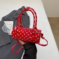 Red polka dot cylinder crossbody bag with glossy patent leather finish and silver hardware - Red (No Pendant)