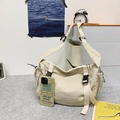 Versatile cream white nylon dumpling shoulder bag with buckle and drawstring details - Off White
