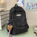 Mochila negra grande con estampado de mármol y oso de peluche en ambiente escolar - Con Colgante / Negro