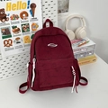 Minimalist burgundy corduroy backpack for students featuring white rope zipper pulls - Red Small