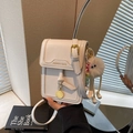Chic cream mini square crossbody bag with plush charm and fashion logo detail - With Charm / White