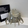 Light grey nylon backpack with drawstring closure and silver metal buckles - Gray