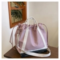 Detailed view of dusty pink nylon tote bag featuring durable drawstrings and off-white straps - Pink