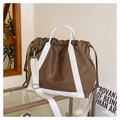 Detail view of brown nylon tote bag with white canvas straps and drawstring closure - Brown