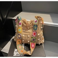 Detail of woven straw tote bag featuring white pearl accents and colorful floral crochet strap - Khaki
