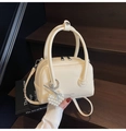 Creamy beige Boston handbag with glossy finish, pearl heart charm and shoulder strap - With Charm / Off White