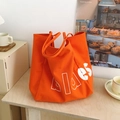 Sac fourre-tout orange en toile avec lettrage blanc idéal pour le style quotidien - Orange