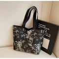 Black canvas tote bag featuring white bamboo forest prints and flat shoulder straps - Black
