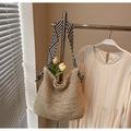 Detailed texture of handwoven straw tote with black and white striped ribbon handle - Striped Ribbon Beige