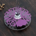 Detail of laser-cut purple hollow wine glass place card with heart and flower patterns - Dark Purple