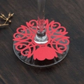 Close-up of red laser-cut heart pattern paper wine glass rings for wedding table decor - Pearlescent Red