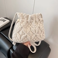 Chic cream macrame woven bucket bag for summer beach fashion with crossbody strap - White