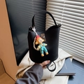 Black lychee leather bucket bag with silver turn-lock and cute cartoon girl charm - Black with Pendant