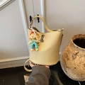 Creamy yellow lychee grain bucket bag with pearl cartoon charm and silver metal lock - Yellow with Pendant