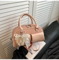 Pink woven handbag with pearl lace charm and dual front pockets in elegant style - With Lace Pendant / Pink