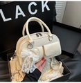 Cream white woven bowling bag with twin front pockets and a pearl bow accessory - With Lace Pendant / White