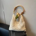 Hollow out woven straw tote bag in cream white with decorative wooden bead handle - Off White