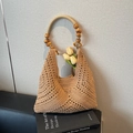 Handwoven khaki straw tote bag featuring decorative wooden beads and hollow weave texture - Khaki