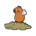 Cute enamel pin featuring a capybara with wings riding on a green crocodile friend - Capybara Riding Crocodile (QHXZ4080)