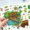 Detalle de mano pelando una pegatina de casita de setas 3D para manualidades y scrapbooking - Estilo Cabaña de Pesca
