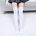 Detailed view of white over-the-knee socks with elastic ribbed cuffs and cotton knit texture - One Size / Pure White