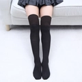 Détail de chaussettes hautes noires en coton avec revers antidérapant et fini mat - Taille unique / Marron et Noir