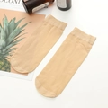 Sheer beige nylon ankle socks featuring ribbed cuffs on a clean decorative background - One Size / Nude No.2