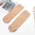 Sheer beige nylon velvet ankle socks for women displayed on a minimalist white background - Nude No.4