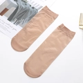Sheer skin-tone ankle socks for women with fine ribbed cuffs shown on a white surface - Nude No.5