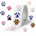 Roll of 500 waterproof cartoon paw print stickers with artistic galaxy and floral designs - Creative Paw Print Style