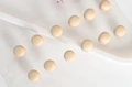 Set of 12 beige matte magnetic scarf clips displayed on a white presentation card - Beige