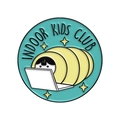 Round blue enamel pin with Indoor Kids Club text and figure wrapped in yellow blanket - Indoor Kids Club (xz7492)