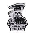 Black enamel graduation skull brooch with 'I GRADUATED FROM LIFE' text and black cap - Skeleton Graduate Style (xz8428)