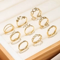 9-piece gold daisy and heart ring set displayed in a premium jewelry gift box - Gold Hollow Heart Butterfly Style