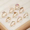 9-piece gold alloy ring set for kids featuring daisies, hearts, pearls and butterfly motifs - Gold Rose Bowknot Style