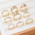 Set of 9 gold-finished open rings for kids featuring daisy, star, and butterfly motifs - Gold Star Butterfly Style