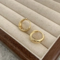 Elegant gold-plated hoop earrings with polished finish displayed on beige velvet jewelry box - Gold 22mm