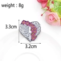 Enamel heart brooch featuring white skeleton ribs and pink daisies with size markings - Heart Rib Cage Floral / Heart Ribs