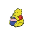 Detailed view of enamel Winnie the Pooh metal brooch holding a blue honey pot - Yellow Bear Holding Honey Pot Style (xz1605)