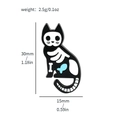 Black enamel skeleton cat brooch with blue fish detail measuring 30mm by 15mm - Skeleton Cat with Fish (XZ2358-7)