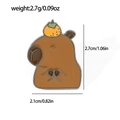 Cute cartoon capybara enamel pin with orange on head shown with size specifications - Capybara with Orange Style (XZ2699-2)