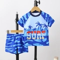 Boys blue two-piece swimwear set with short sleeve surf top and coconut tree print - 4Y / Blue